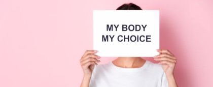 person holding sign reading my body my choice
